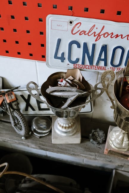Rustic decor featuring vintage license plates and trophy cups in an auto repair shop.